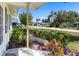 Inviting front porch with lush landscaping and charming street view, perfect for relaxing outdoors at 4375 Tortoise Rd, Venice, FL 34293