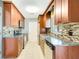 Modern kitchen featuring granite countertops, stainless steel appliances, and mosaic backsplash at 4375 Tortoise Rd, Venice, FL 34293