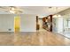 Spacious and bright open-concept living area with tile floors that transition to the updated kitchen at 4375 Tortoise Rd, Venice, FL 34293
