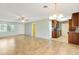 Bright, open-concept living area with tile flooring and a view of the kitchen and dining spaces at 4375 Tortoise Rd, Venice, FL 34293