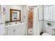 Cozy bathroom with a vanity, toilet, and a separate shower with pink tiling at 4535 Maceachen Blvd, Sarasota, FL 34233