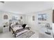 Comfortable bedroom with a queen-sized bed, classic décor, and bright natural lighting at 4535 Maceachen Blvd, Sarasota, FL 34233