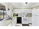 Well-maintained kitchen equipped with essential appliances, perfect for everyday meal preparation at 4535 Maceachen Blvd, Sarasota, FL 34233