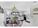 Bright kitchen and adjacent dining area with ample counter space and modern appliances at 4535 Maceachen Blvd, Sarasota, FL 34233