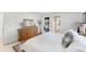 Bright main bedroom featuring a queen-sized bed, classic décor, and exterior access at 4535 Maceachen Blvd, Sarasota, FL 34233