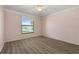 Bedroom featuring hardwood floors, natural light, ceiling fan, and neutral pink walls at 4622 34Th E Ct, Bradenton, FL 34203