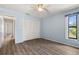 Bedroom featuring wood floors, natural light, a closet, and light blue walls at 4622 34Th E Ct, Bradenton, FL 34203