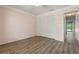 Bedroom featuring hardwood floors, neutral pink walls, closet, and ceiling fan at 4622 34Th E Ct, Bradenton, FL 34203