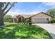 Charming single-story home with a well-manicured lawn and attached two-car garage at 4622 34Th E Ct, Bradenton, FL 34203