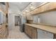 Well-equipped kitchen features wooden cabinets, stainless steel appliances, and tile floors at 4622 34Th E Ct, Bradenton, FL 34203