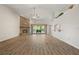 Bright living room boasts high ceilings, a brick fireplace, and hardwood floors at 4622 34Th E Ct, Bradenton, FL 34203