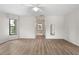 Spacious main bedroom featuring wood floors, abundant natural light, and access to the bathroom at 4622 34Th E Ct, Bradenton, FL 34203