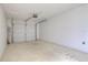 Spacious two-car garage with an automatic door, offering secure parking and ample storage space at 478 Orange Nw Dr, Port Charlotte, FL 33952