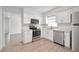 Kitchen with stainless steel appliances, including a dishwasher and microwave, plus white cabinetry at 478 Orange Nw Dr, Port Charlotte, FL 33952