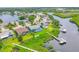 Aerial view of waterfront homes with backyard pools and docks at 4844 14Th E Ave, Bradenton, FL 34208