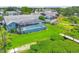 Aerial view of a backyard with a pool and dock at 4844 14Th E Ave, Bradenton, FL 34208