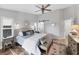 Spacious main bedroom with a ceiling fan, wood floors, and natural light at 4844 14Th E Ave, Bradenton, FL 34208