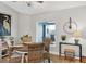 Cozy dining area with rattan chairs, views from a large window, and stylish decor at 4844 14Th E Ave, Bradenton, FL 34208