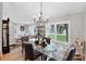 Open dining area with a glass table and view into the bright and comfortable living area at 4844 14Th E Ave, Bradenton, FL 34208