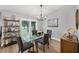 Dining area with a modern glass table, stylish chairs, and bright natural light at 4844 14Th E Ave, Bradenton, FL 34208