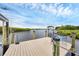 Waterfront home boasts a private boat dock with a bench and boat lift at 4844 14Th E Ave, Bradenton, FL 34208