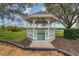 View of a community gazebo situated near water and landscaping at 4844 14Th E Ave, Bradenton, FL 34208