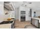 Bright kitchen features stainless steel appliances and light wood floors at 4844 14Th E Ave, Bradenton, FL 34208