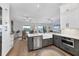 Open concept kitchen with stainless appliances and view of the breakfast area and outside at 4844 14Th E Ave, Bradenton, FL 34208
