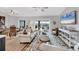 Open-concept living area with dining space and access to lanai and water views at 4844 14Th E Ave, Bradenton, FL 34208