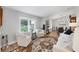 Bright and airy living room with hardwood floors, plantation shutters, and elegant decor at 4844 14Th E Ave, Bradenton, FL 34208