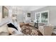 Bright living room featuring hardwood floors, plantation shutters, and elegant neutral decor at 4844 14Th E Ave, Bradenton, FL 34208