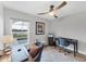 Well-lit home office featuring a desk, chair, view to pool, and calming décor at 4844 14Th E Ave, Bradenton, FL 34208