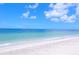 Beautiful sandy beach with clear, turquoise water perfect for swimming, sunbathing, and relaxation at 500 N Jefferson Ave # G5, Sarasota, FL 34237