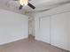 Neutral bedroom with tile flooring, neutral walls, and closet at 500 N Jefferson Ave # G5, Sarasota, FL 34237
