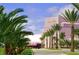 Van Wezel Performing Arts Hall under a blue sky, framed by palm trees and manicured landscaping at 500 N Jefferson Ave # G5, Sarasota, FL 34237