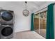 Convenient laundry area featuring a modern washer and dryer unit at 500 N Jefferson Ave # G5, Sarasota, FL 34237