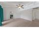 View of the living room with tile flooring and access to the backyard patio at 500 N Jefferson Ave # G5, Sarasota, FL 34237