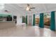 Bright open living area with tile floors, modern appliances, and backyard access at 500 N Jefferson Ave # G5, Sarasota, FL 34237