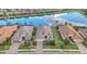 Stunning aerial view of the house with lush landscaping and a beautiful lake at 5011 Tivoli Run, Bradenton, FL 34211