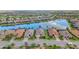 Beautiful aerial view of a home with a picturesque lake and well-kept lawns at 5011 Tivoli Run, Bradenton, FL 34211