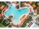 Aerial view of a unique pool with lounge chairs and umbrellas at 5011 Tivoli Run, Bradenton, FL 34211