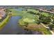 Beautifully landscaped golf course community with water features and green fairways at 5011 Tivoli Run, Bradenton, FL 34211