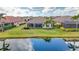Serene backyard with a screened lanai and stunning lake view at 5011 Tivoli Run, Bradenton, FL 34211