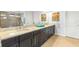 Bathroom with double vanity, granite countertop, dark cabinets, and tile floors at 5011 Tivoli Run, Bradenton, FL 34211
