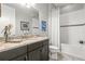 Bright bathroom with shower/tub combination and granite vanity at 5011 Tivoli Run, Bradenton, FL 34211