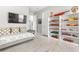 Charming bedroom featuring a daybed and a custom display of vintage toy replicas at 5011 Tivoli Run, Bradenton, FL 34211