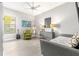 Versatile bedroom with daybed, chair, and desk offers comfortable space at 5011 Tivoli Run, Bradenton, FL 34211