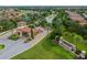 Aerial view of the community entrance with guard house, landscaping, and decorative signage at 5011 Tivoli Run, Bradenton, FL 34211