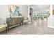 Spacious foyer leading to an open floor plan, decorative furniture, and a view of the dining room at 5011 Tivoli Run, Bradenton, FL 34211