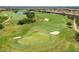 Breathtaking aerial view of a lush green golf course in an upscale golf community at 5011 Tivoli Run, Bradenton, FL 34211